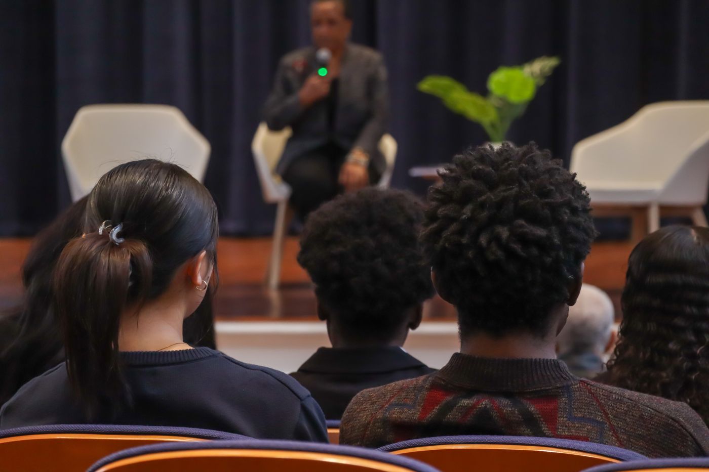 Dr. Joyce E. King delivering the opening keynote, audience in foreground